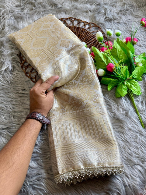 Luxurious Banarasi silk in antique zari, adorned with: