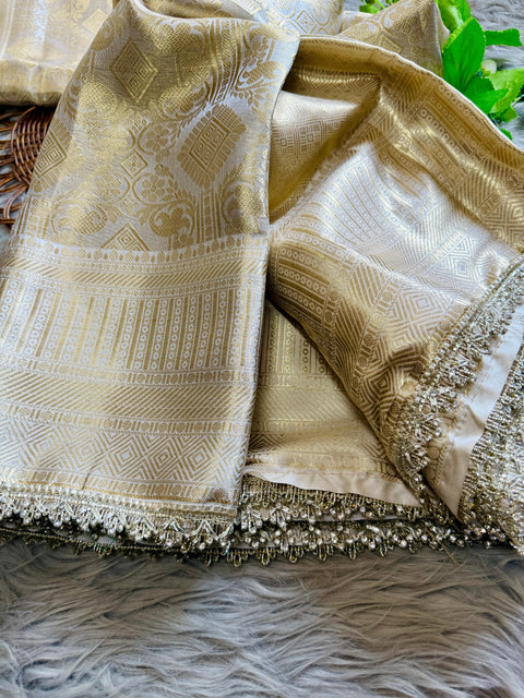 Luxurious Banarasi silk in antique zari, adorned with: