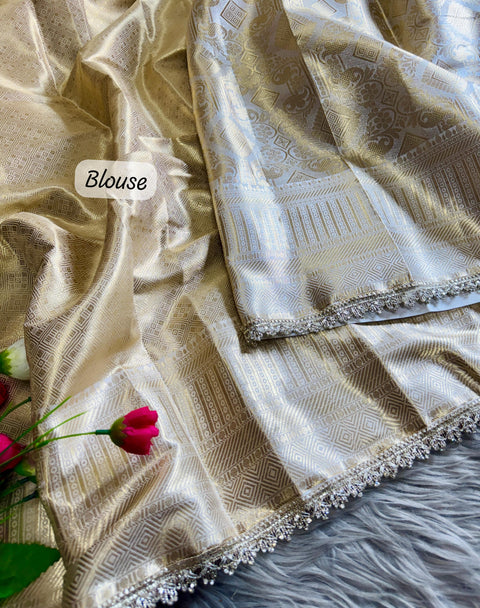Luxurious Banarasi silk in antique zari, adorned with: