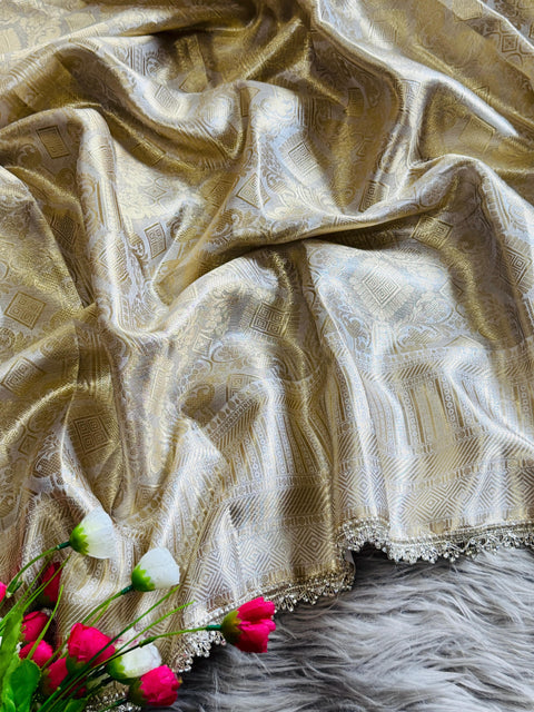 Luxurious Banarasi silk in antique zari, adorned with: