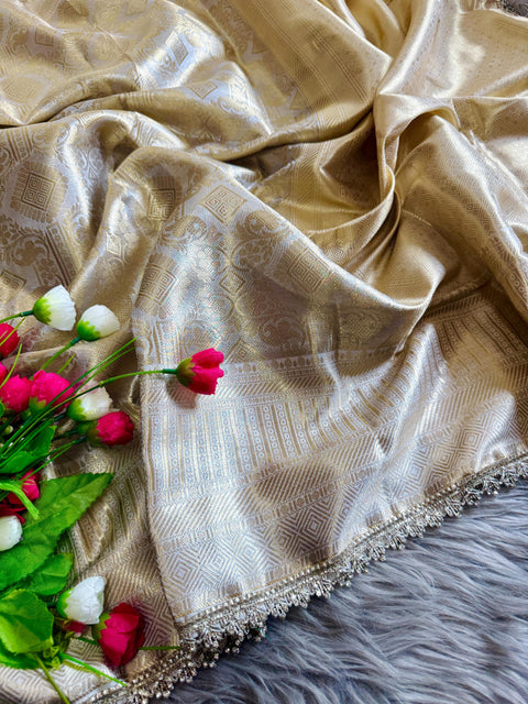 Luxurious Banarasi silk in antique zari, adorned with:
