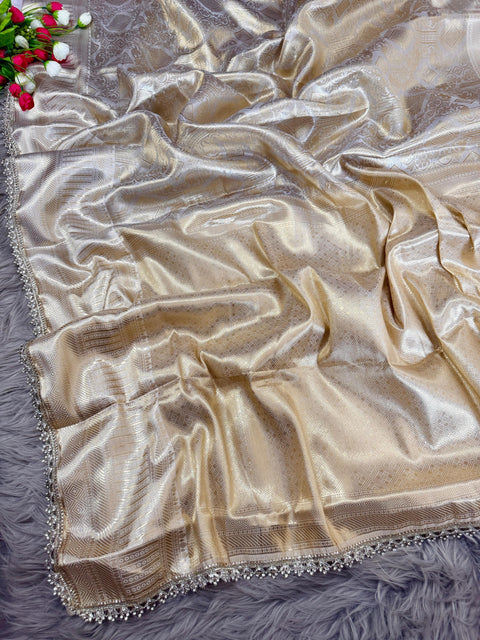 Luxurious Banarasi silk in antique zari, adorned with: