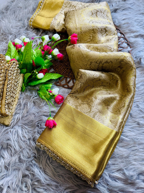 this golden tissue silk saree has beautiful ghungroo and pearl border