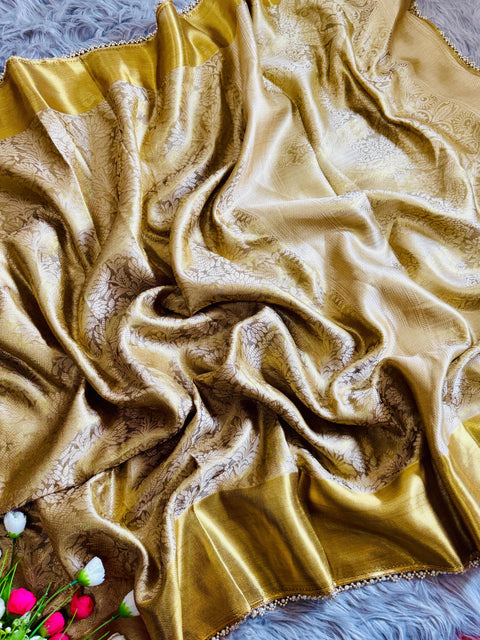 this golden tissue silk saree has beautiful ghungroo and pearl border